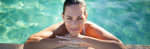 Woman with Glowing Skin in the Pool - Strong Cell, Liquid NADH, CoQ10, Collagen for Cellular Health and Glowing Skin. Tips for Anti-Aging