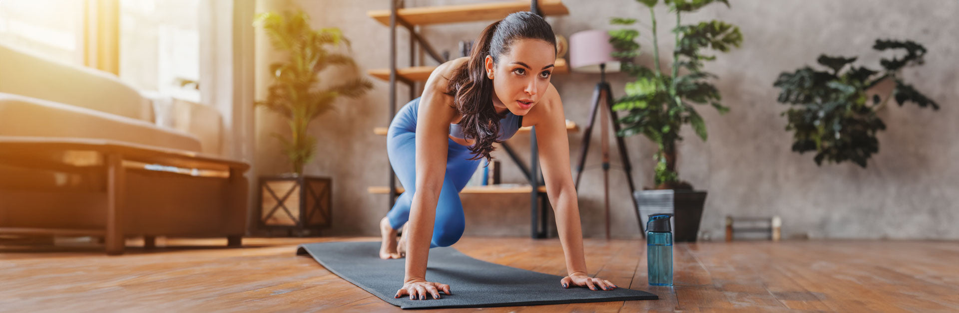 Woman Doing Yoga with Strong Cell Bottle - Liquid NADH, CoQ10, Collagen for Cellular Health